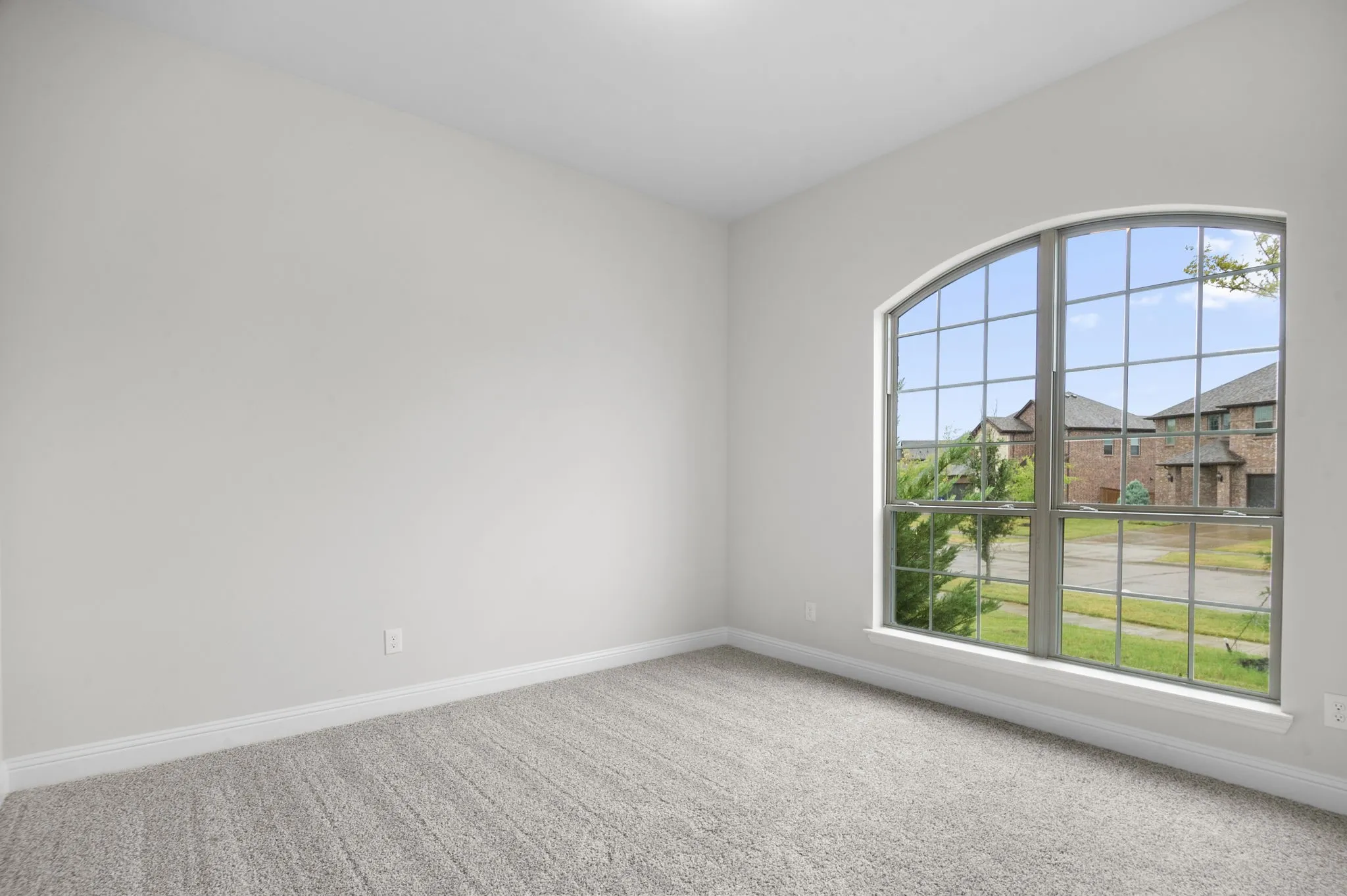 Carpeted spare room with plenty of natural light