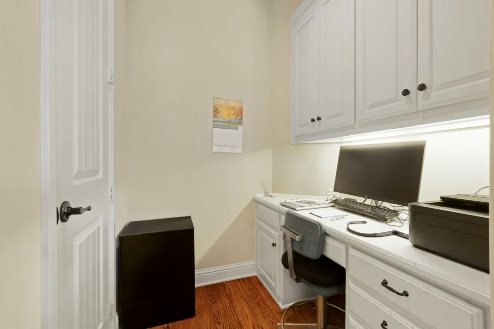Office nook off the kitchen, there is a full-size office with French doors of the entry as well.