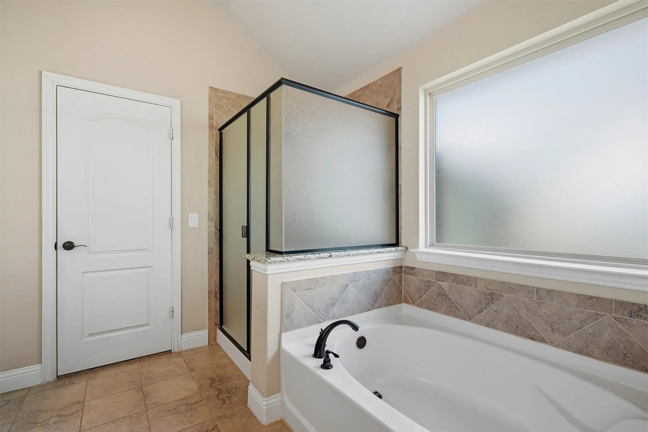 Enjoy the separate bathtub and shower, as well as a large walk-in closet