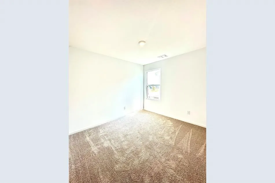 Unfurnished room featuring carpet floors
