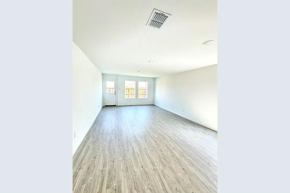 Unfurnished room with light wood-type flooring