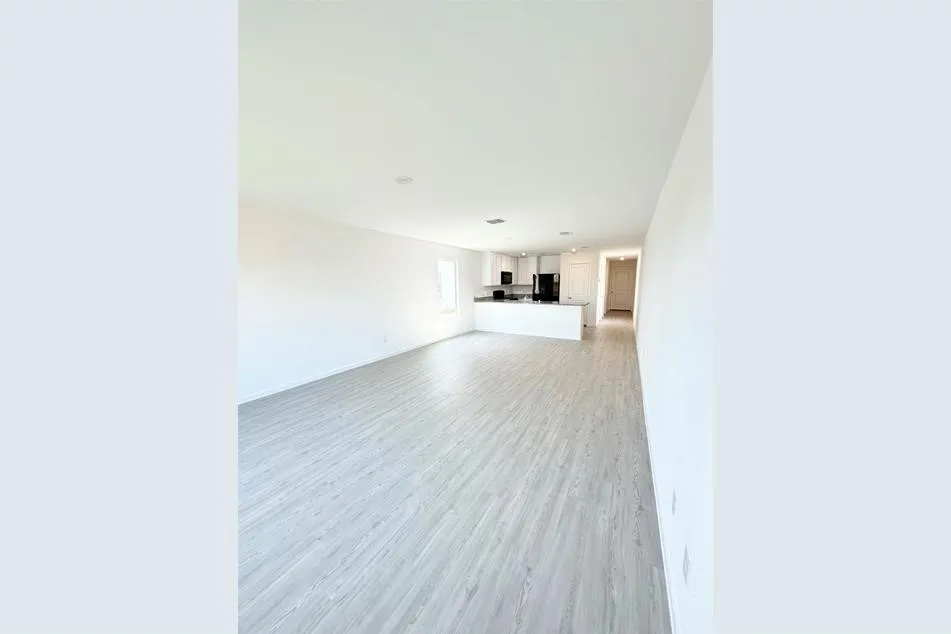 Unfurnished living room with light hardwood / wood-style flooring