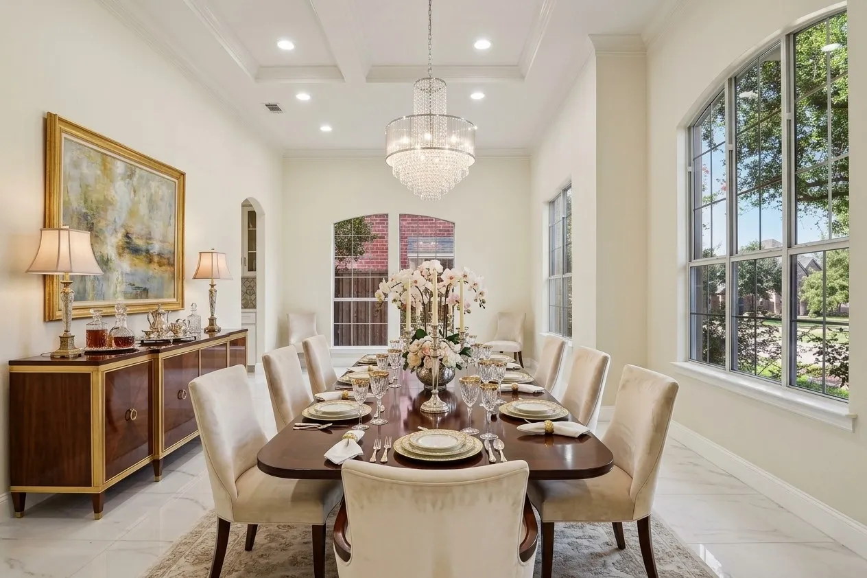 AI Staged, Recessed lighting, elegant coffered ceiling, and a crystal chandelier illuminate this formal dining area