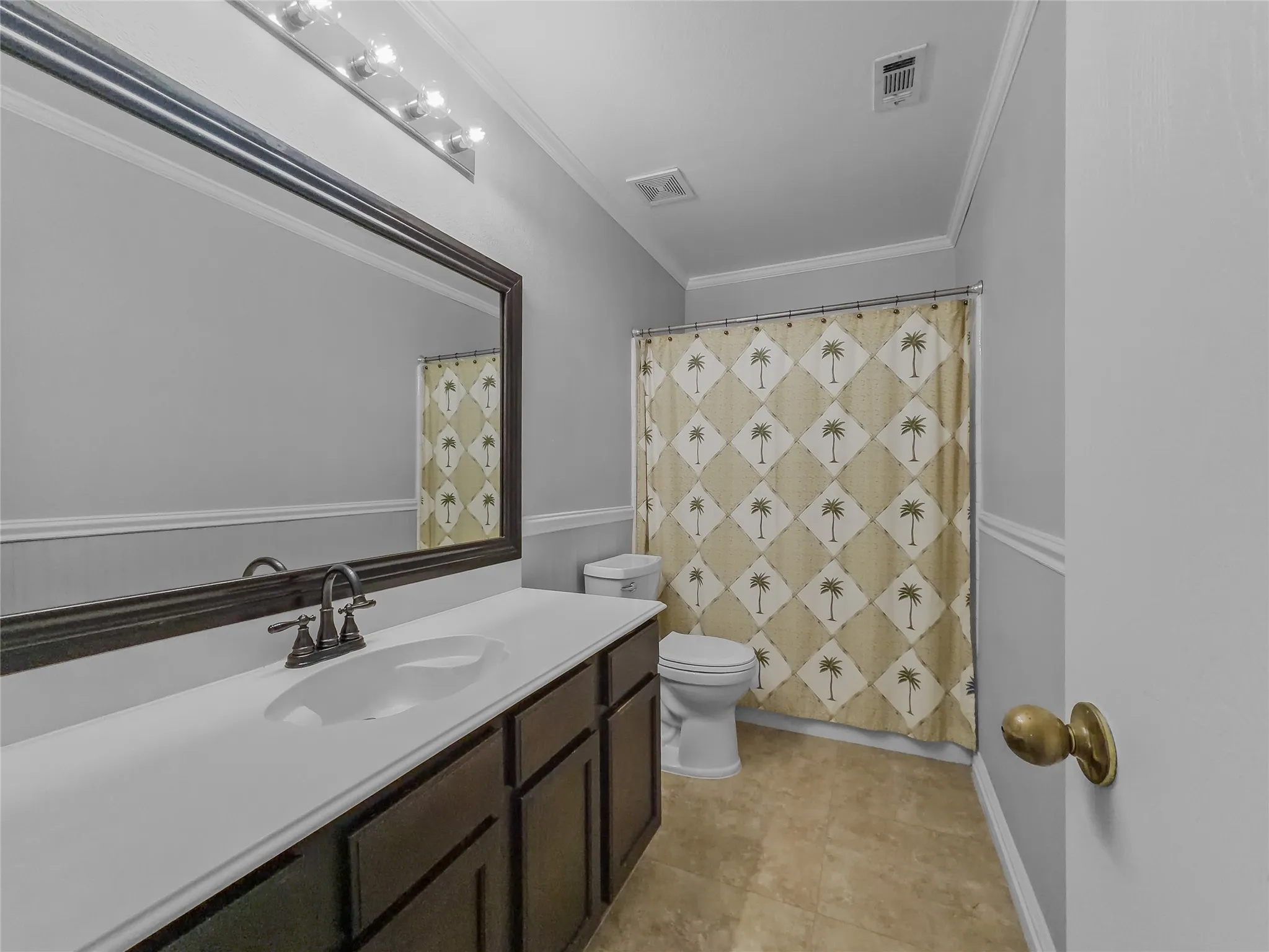 Dark wood-finish vanity with an integrated white sink and dark bronze-toned faucet