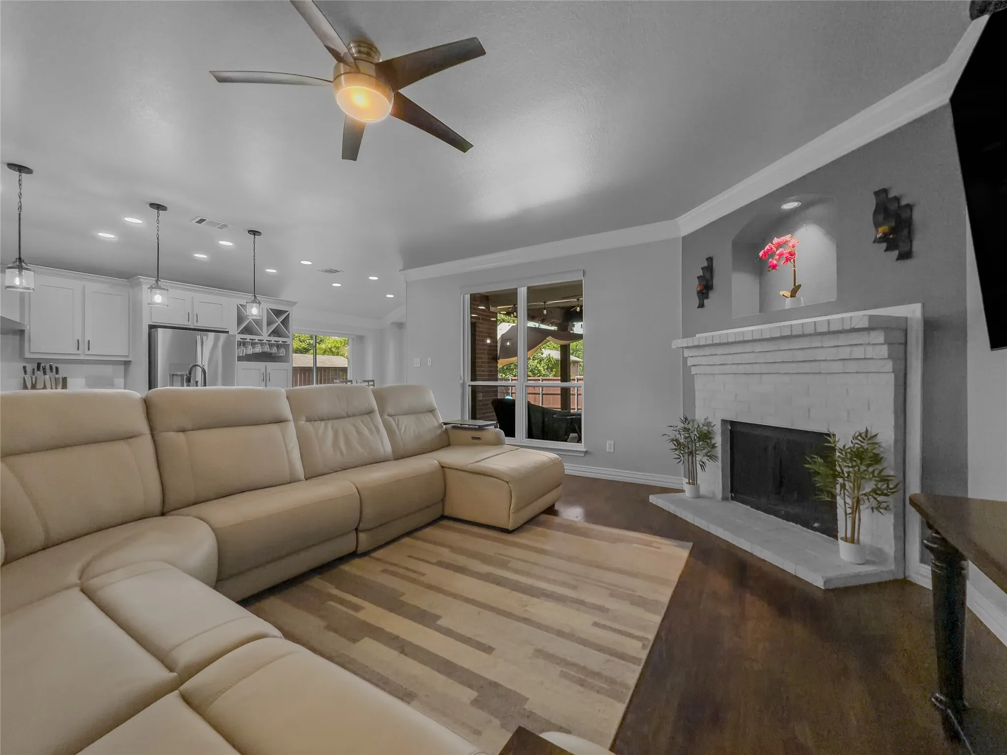 Wood-finish flooring, recessed lighting, and a modern ceiling fan