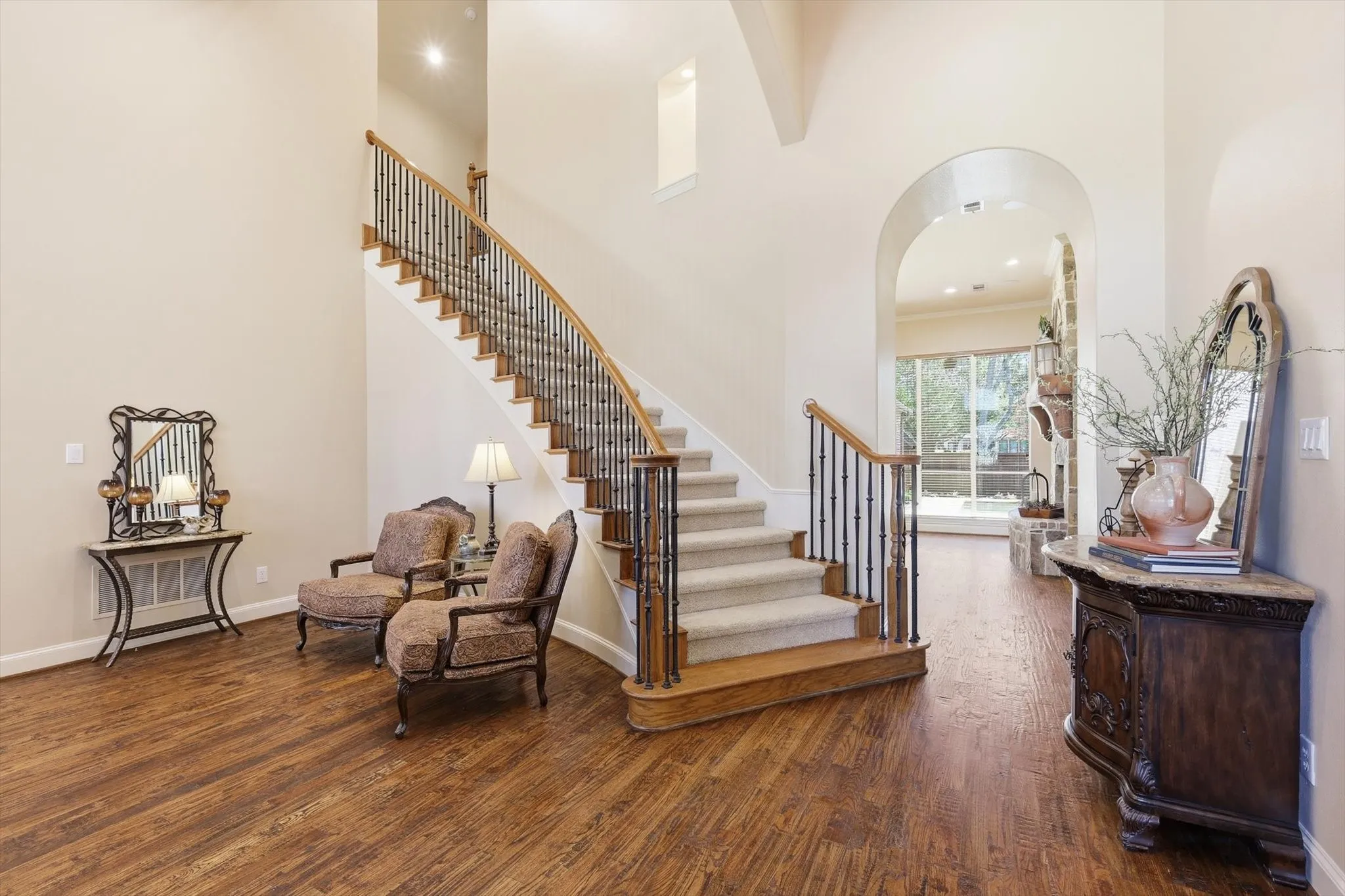 Sweeping staircase, vaulted ceilings and extra wood trim finishes compliment the extensive handscraped hardwood flooring throughout level 1 both homes
