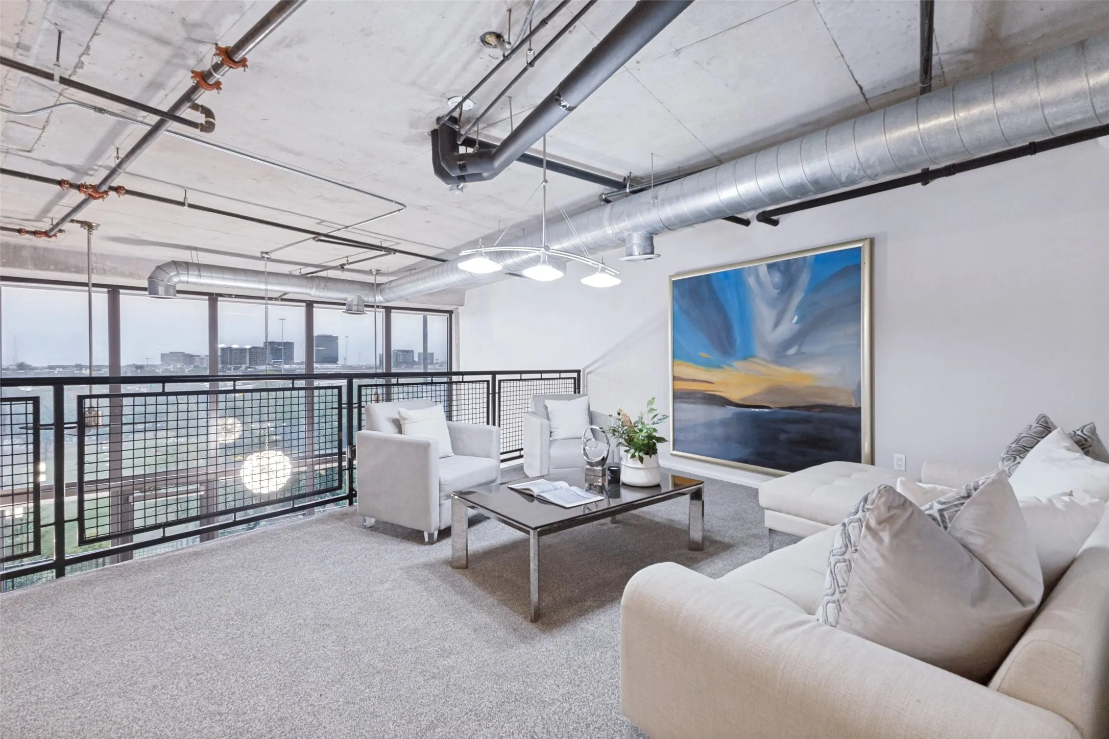 Loft-style bedroom featuring an exposed ceiling with dark beams and ductwork, a ceiling fan, and light gray carpet flooring