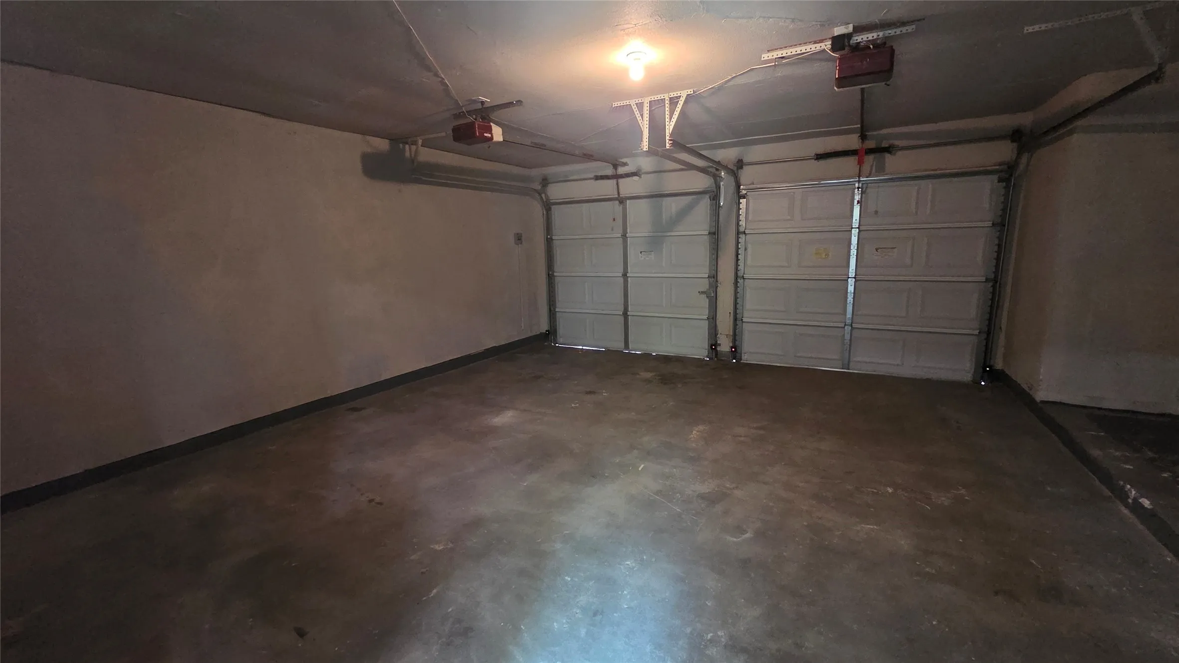 Finished garage with 2 doors and remote lifts