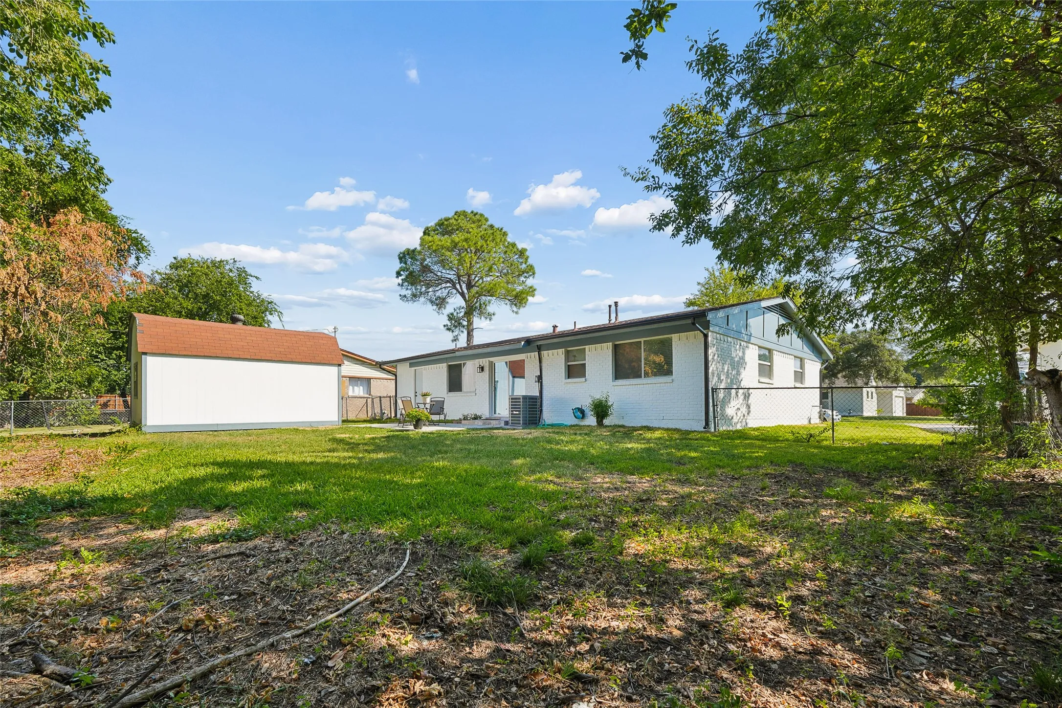Charming ranch-style home situated on expansive grounds with mature tree coverage