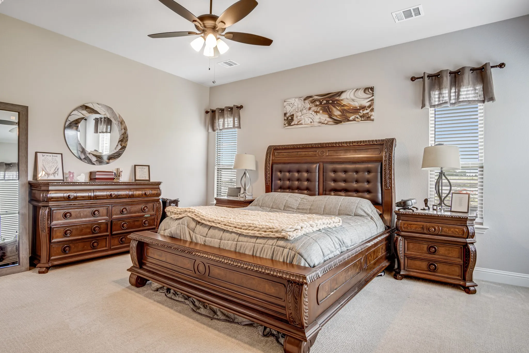 Carpeted room featuring a ceiling fan with integrated lighting, window blinds, and recessed lighting