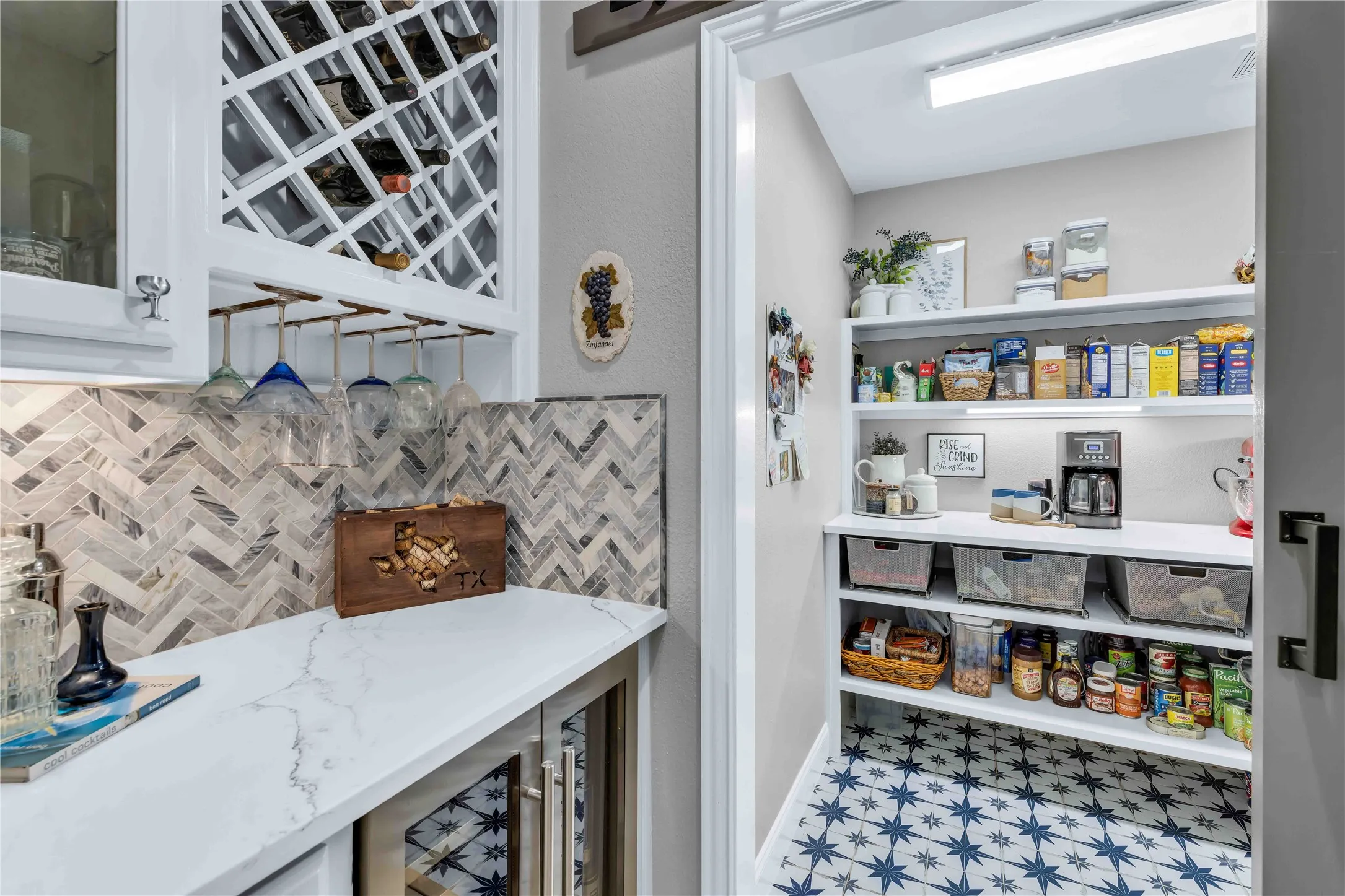 Dedicated beverage area featuring a built-in wine rack, stemware storage, and marble-look countertop