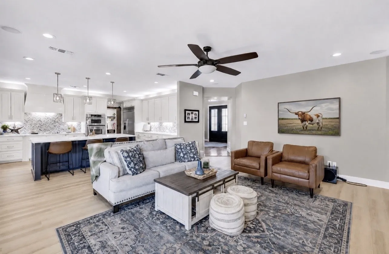 Open-concept living area with wood-finish flooring