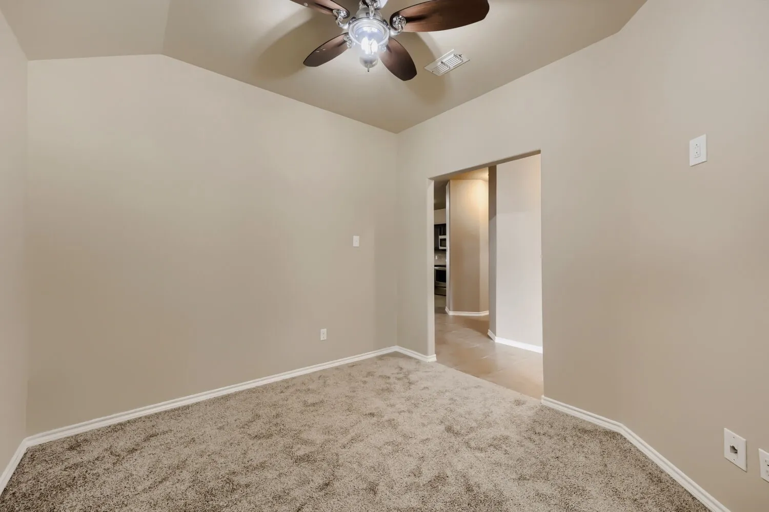 Vaulted ceiling with an integrated ceiling fan and light fixture