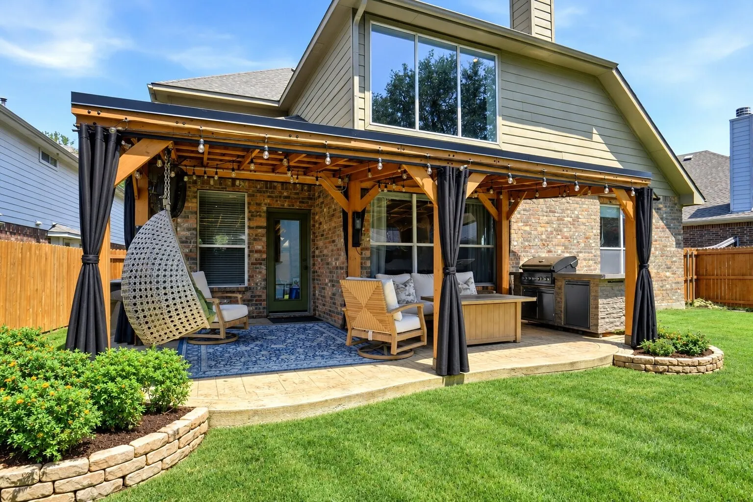 Upgraded outdoor living area featuring an extended stamped and colored concrete patio, large pergola with electricity and lighting, and custom mosquito netting for added comfort. Photos have been AI enhanced for presentation; no material property features were altered.