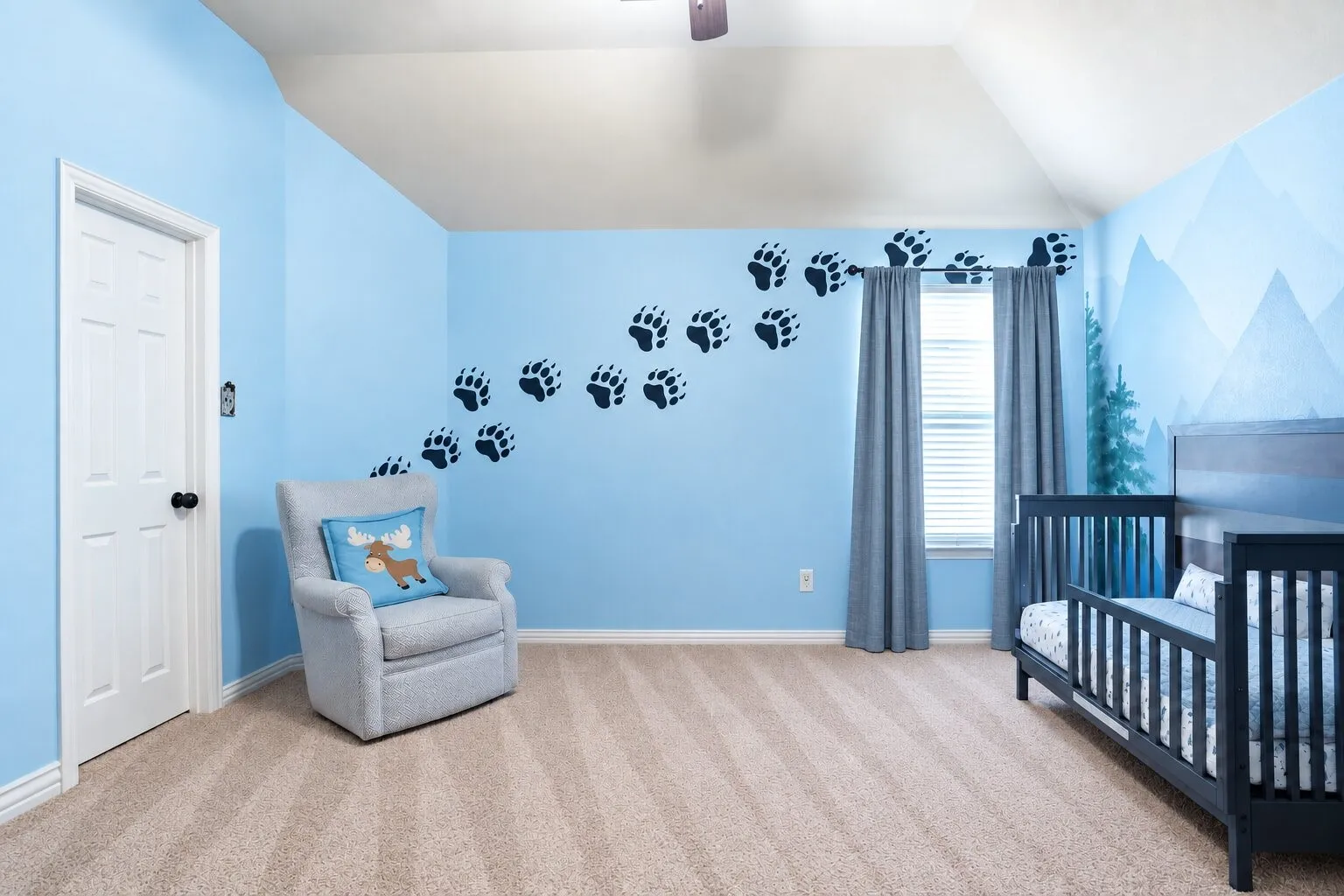 Spacious upstairs bedroom featuring a vaulted ceiling, abundant natural light, and room for additional furniture or seating. Photos have been AI enhanced for presentation; no material property features were altered.