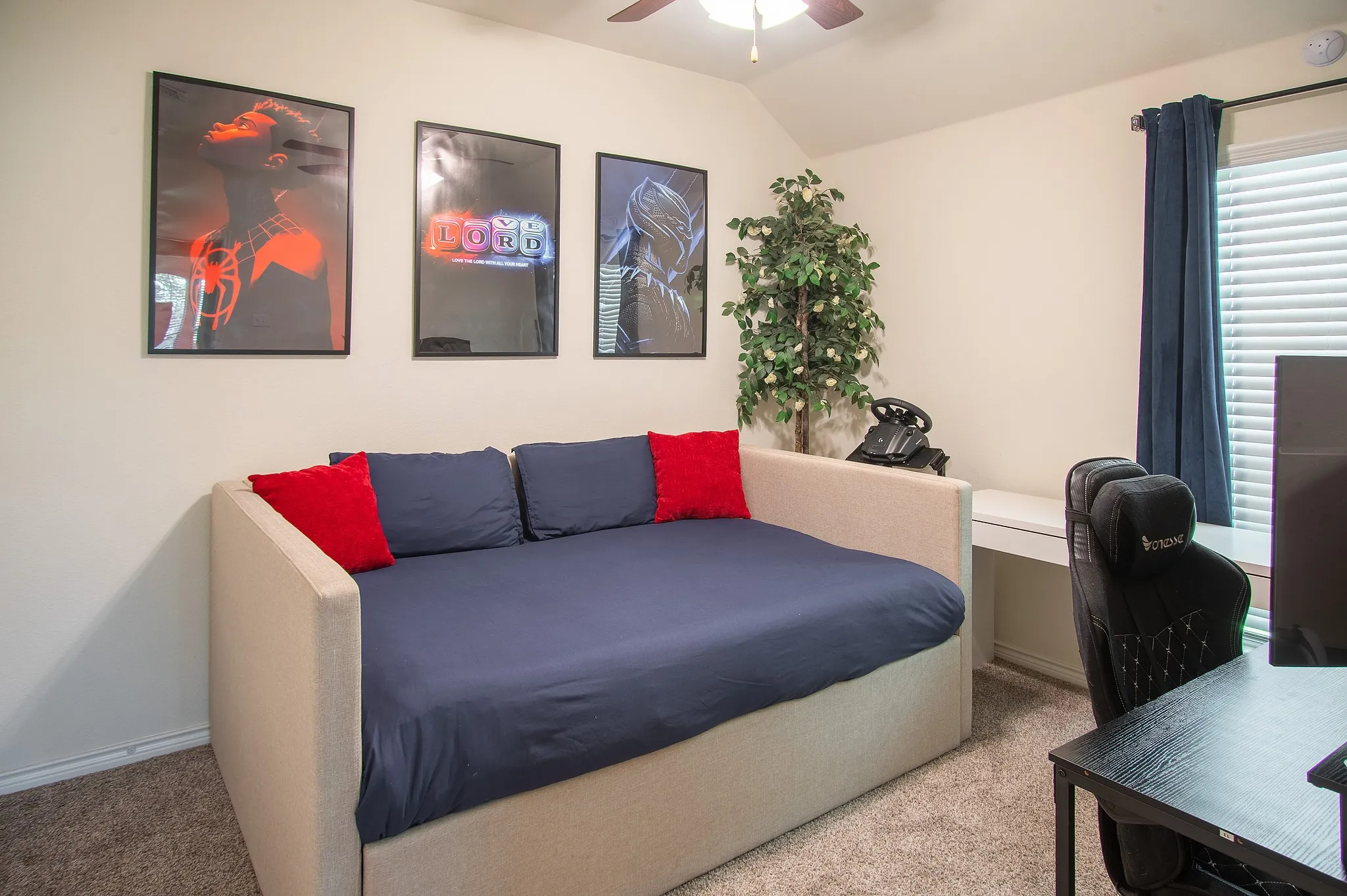 Carpeted room with a ceiling fan, a window featuring blinds and dark curtains, and light-colored walls