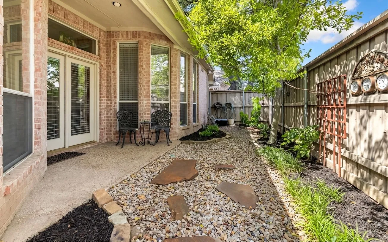 Brick exterior with multiple windows and French doors