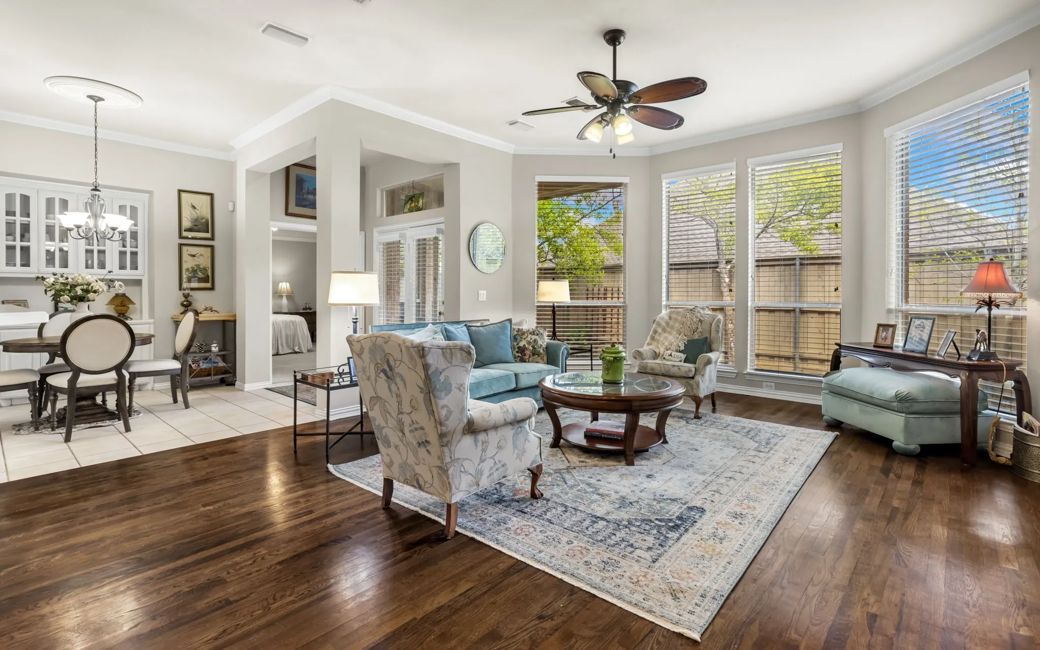 Rich wood-finish flooring and tile flooring define distinct areas