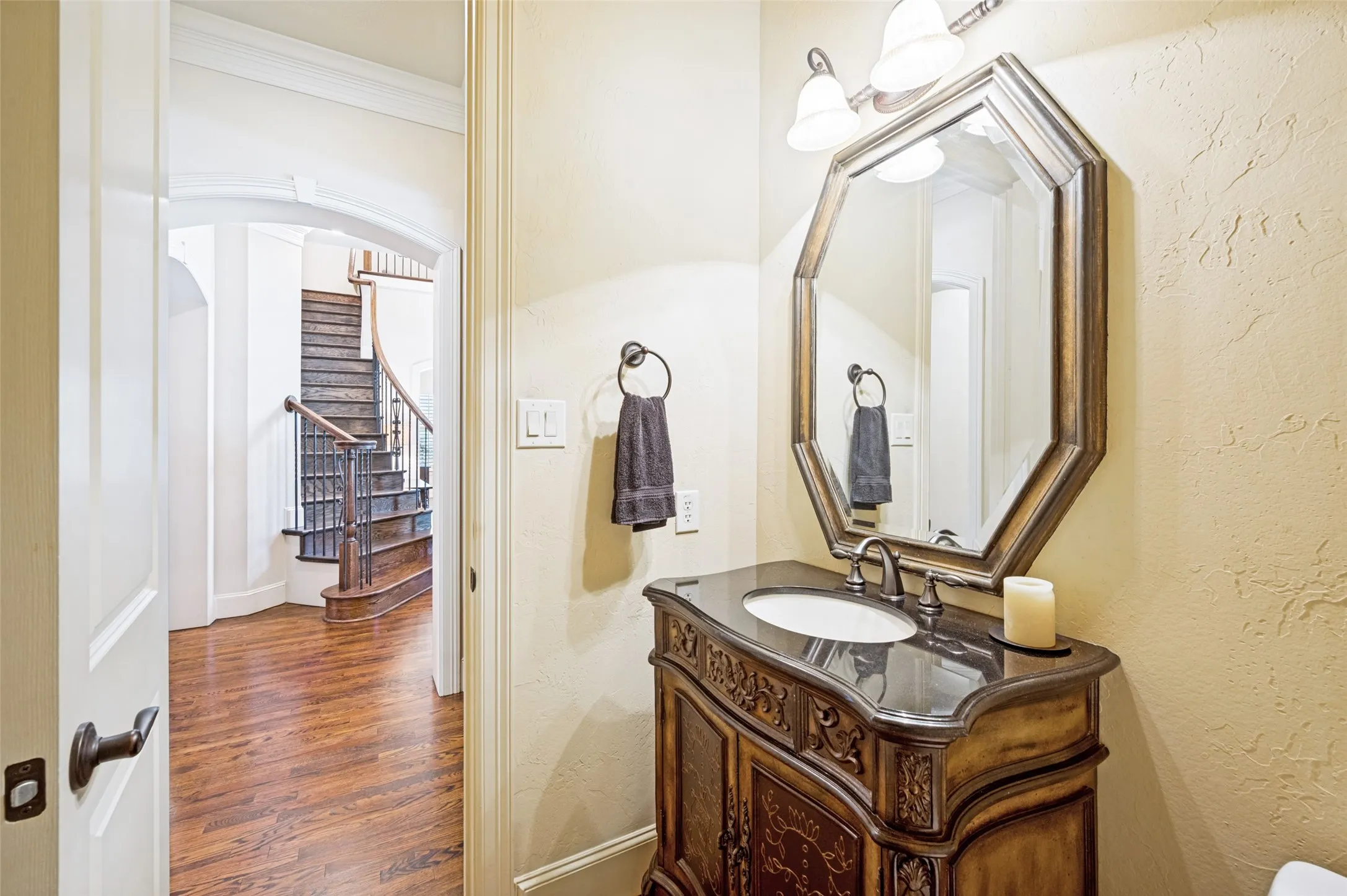 Traditional vanity with dark countertop and undermount sink