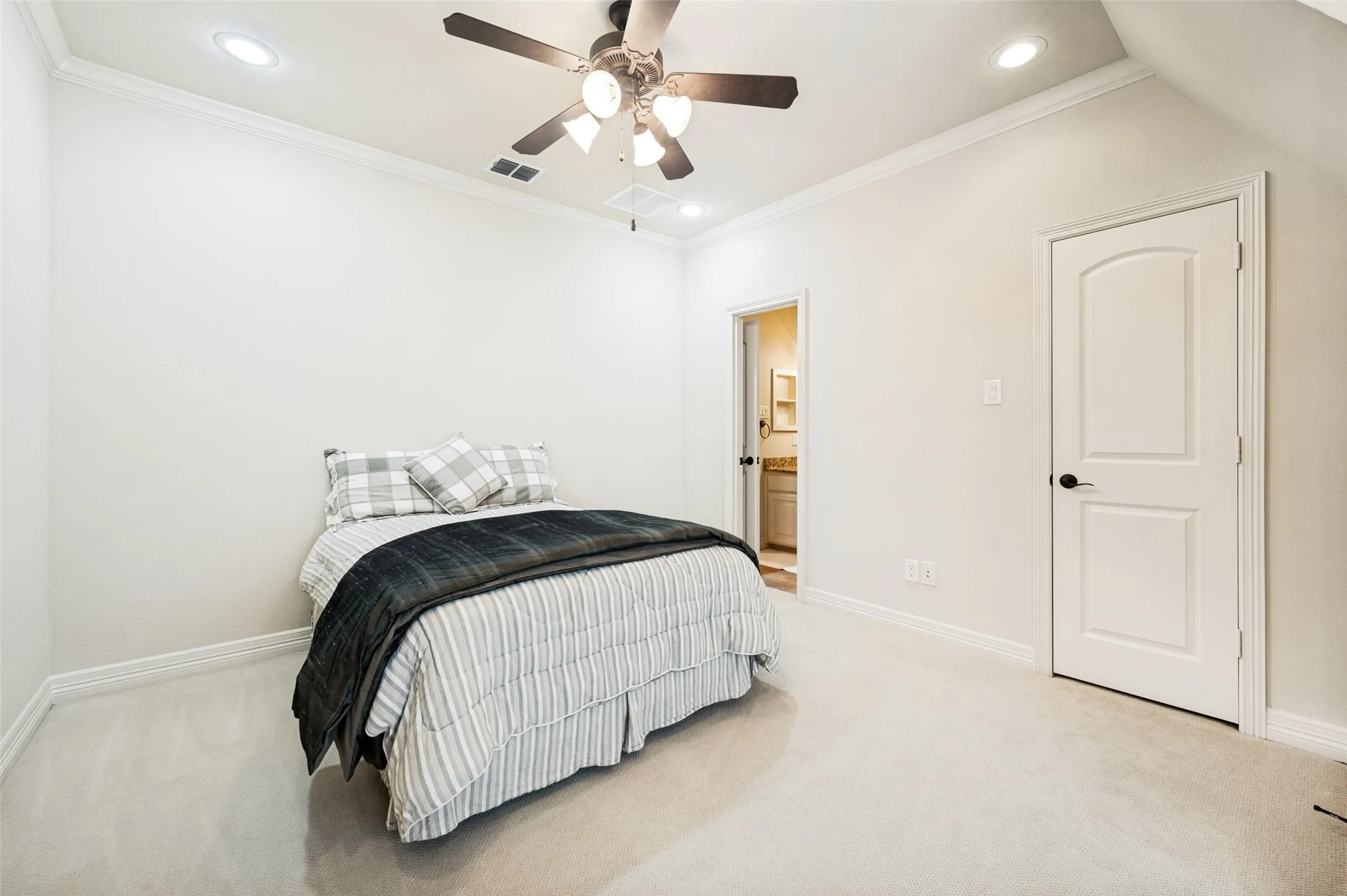 Carpeted room featuring crown molding, recessed lighting, and a ceiling fan with integrated lighting