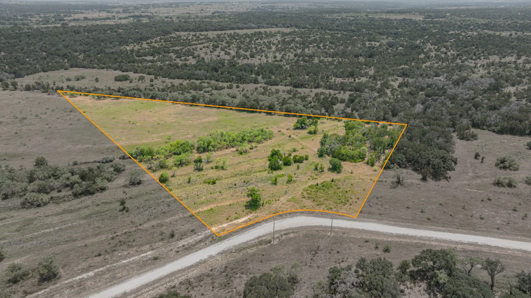 Expansive lot featuring varied topography and natural vegetation