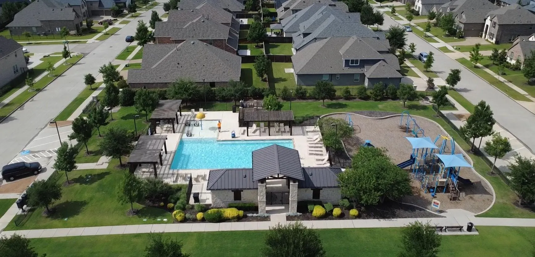 Community amenities featuring a swimming pool, clubhouse, multiple pergolas, and a playground