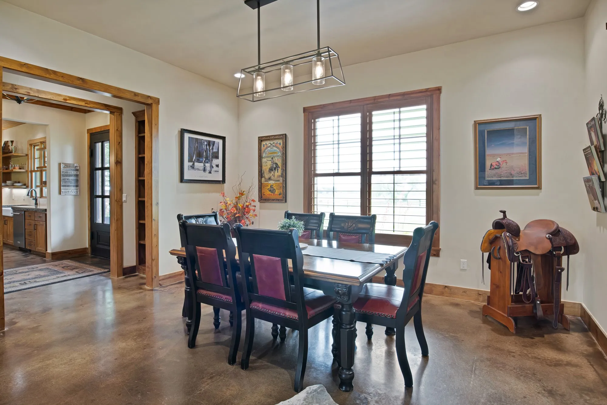 Spacious dining area featuring wood-finish flooring, recessed lighting, and a modern rectangular chandelier