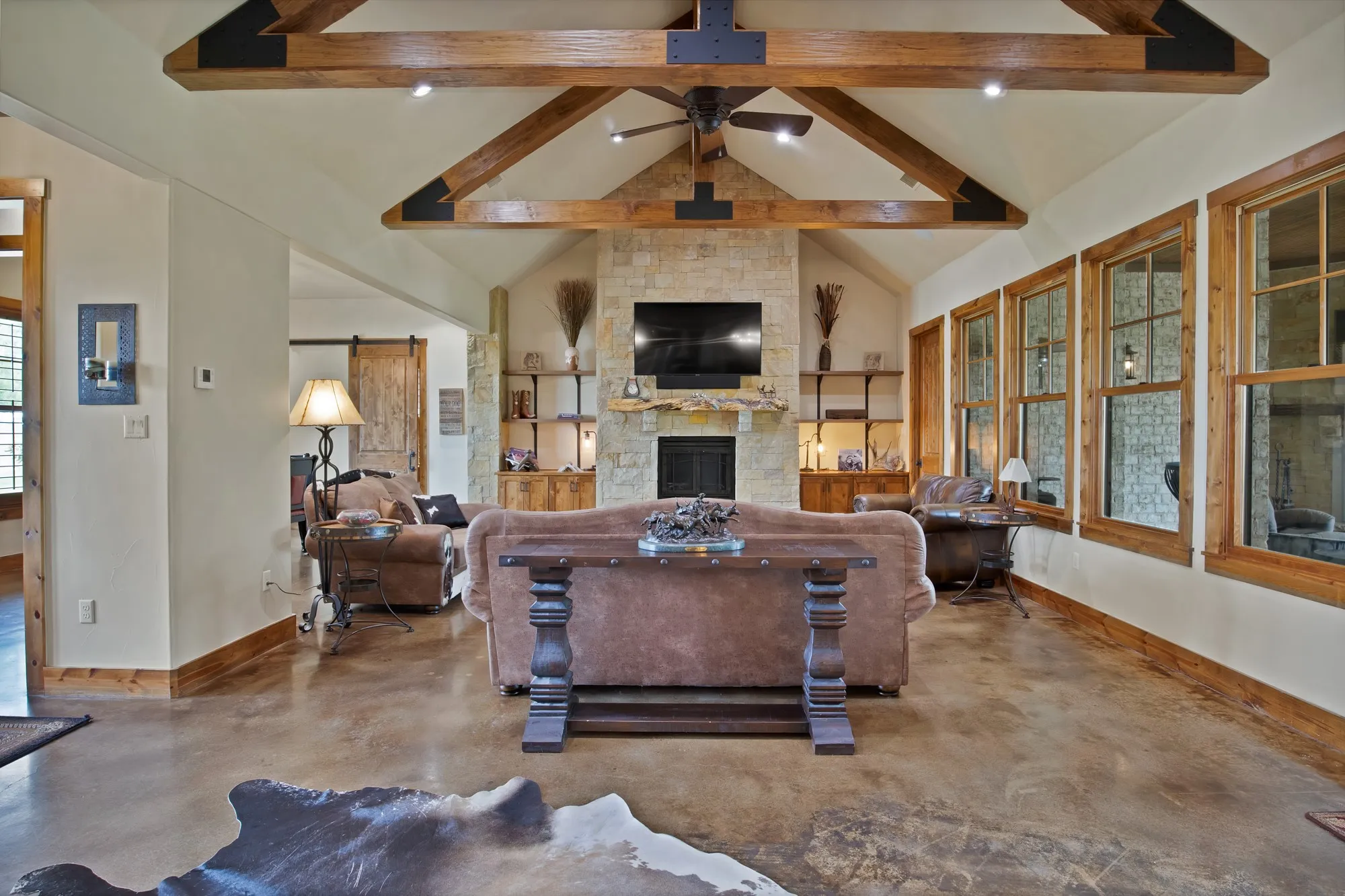 Vaulted ceiling with exposed wood beams and metal accents