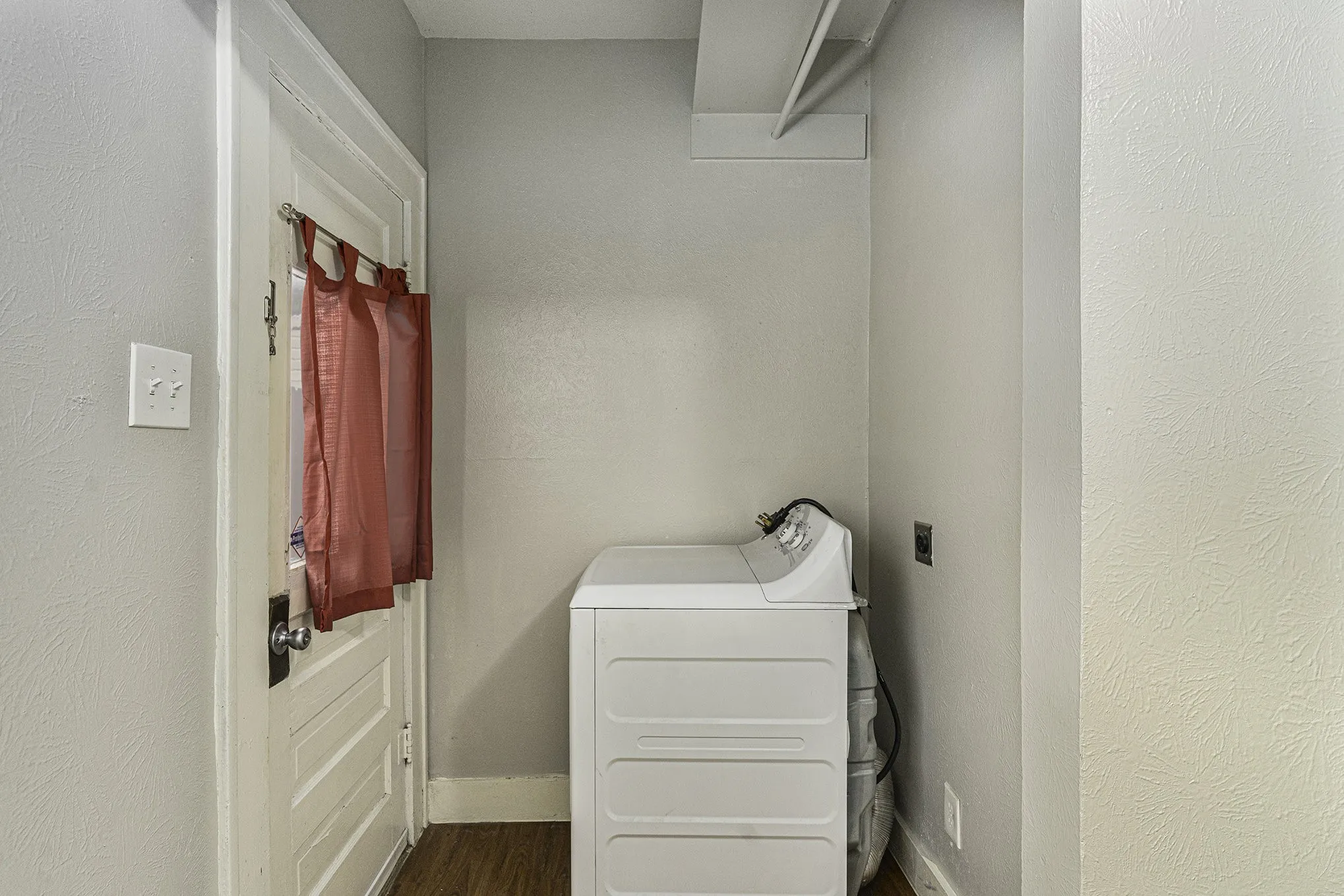 Laundry area featuring washer / dryer and hardwood / wood-style flooring