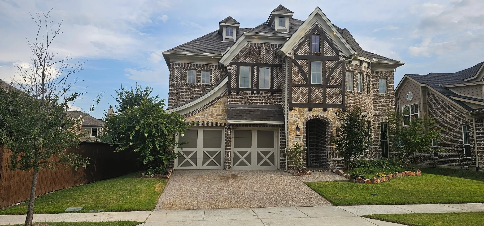 Brick and stone exterior with decorative timber accents