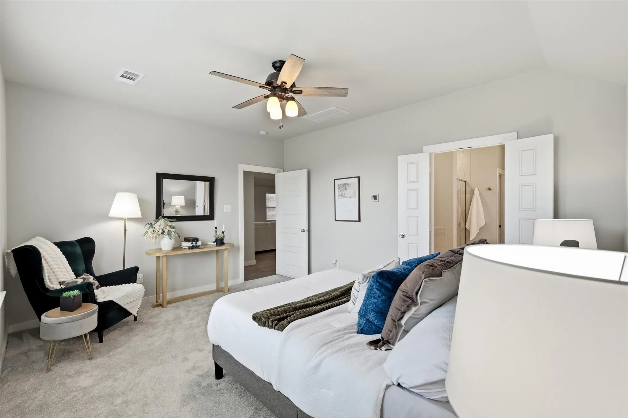 MASSIVE private primary bedroom with natural light ceiling fan and ensuite bathroom!