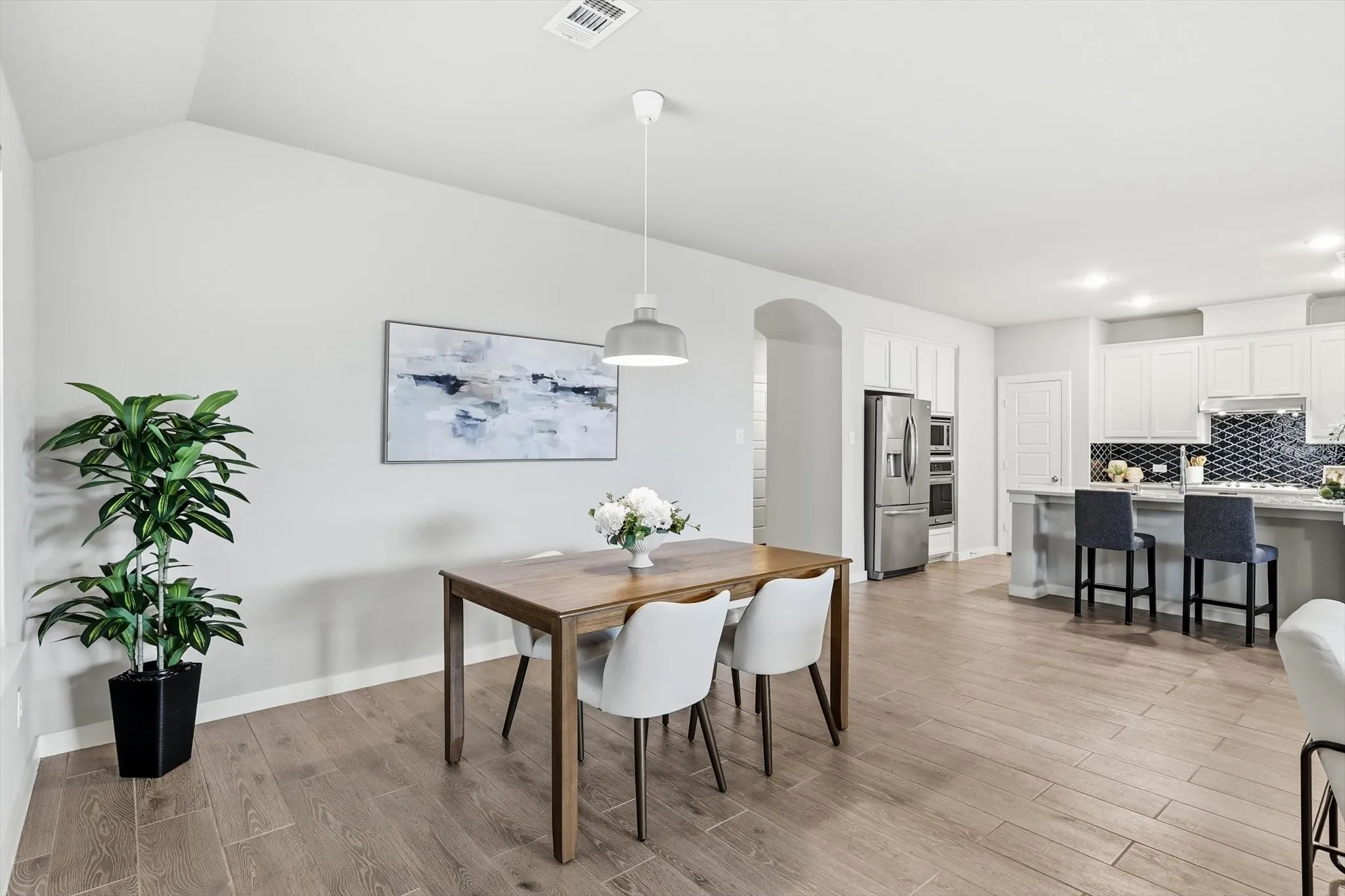 Open concept dining space overlooking the kitchen, living and breakfast area. This can be used as you choose, does not have to be a dining space.