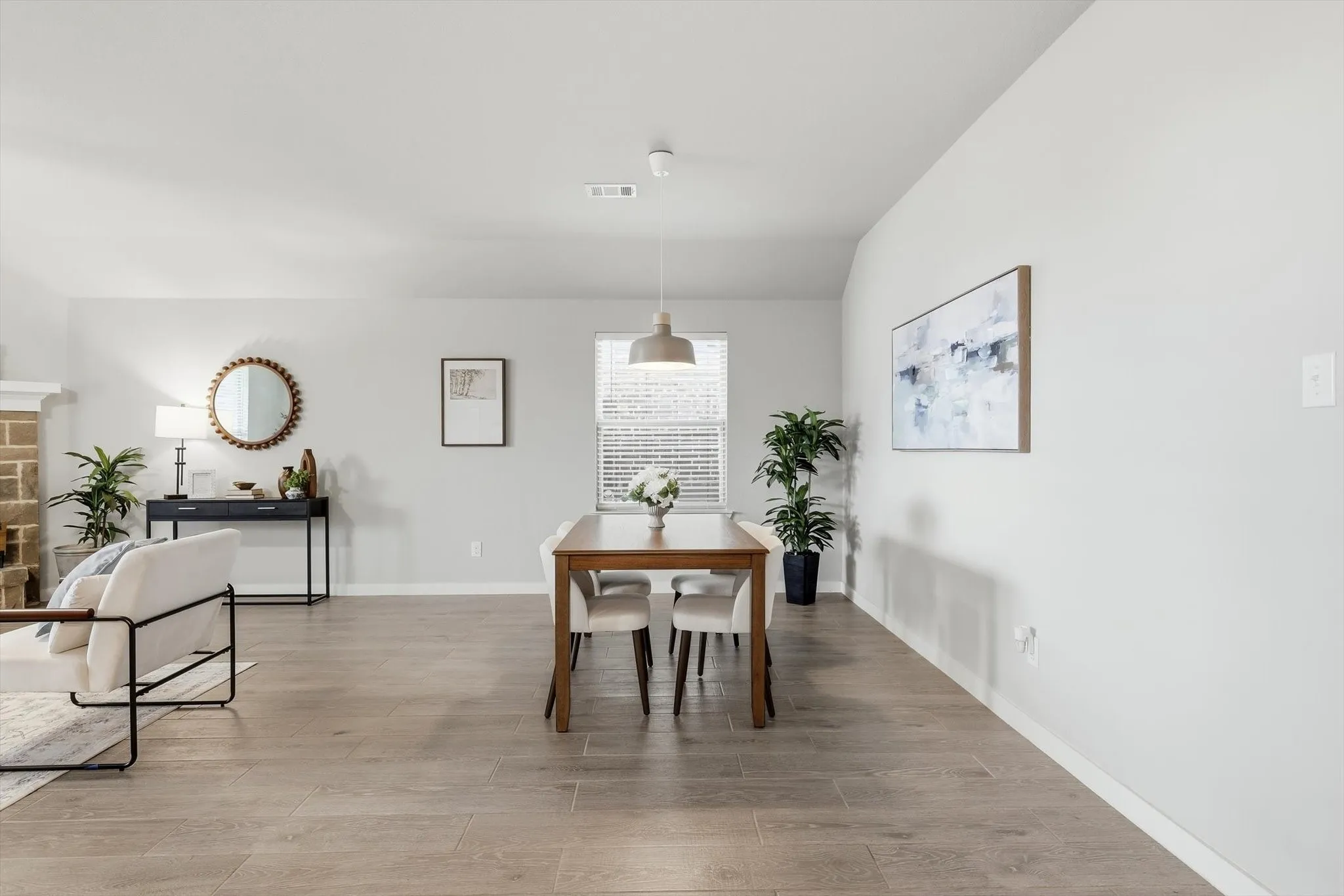 Open concept dining space overlooking the kitchen, living and breakfast area. This can be used as you choose, does not have to be a dining space.