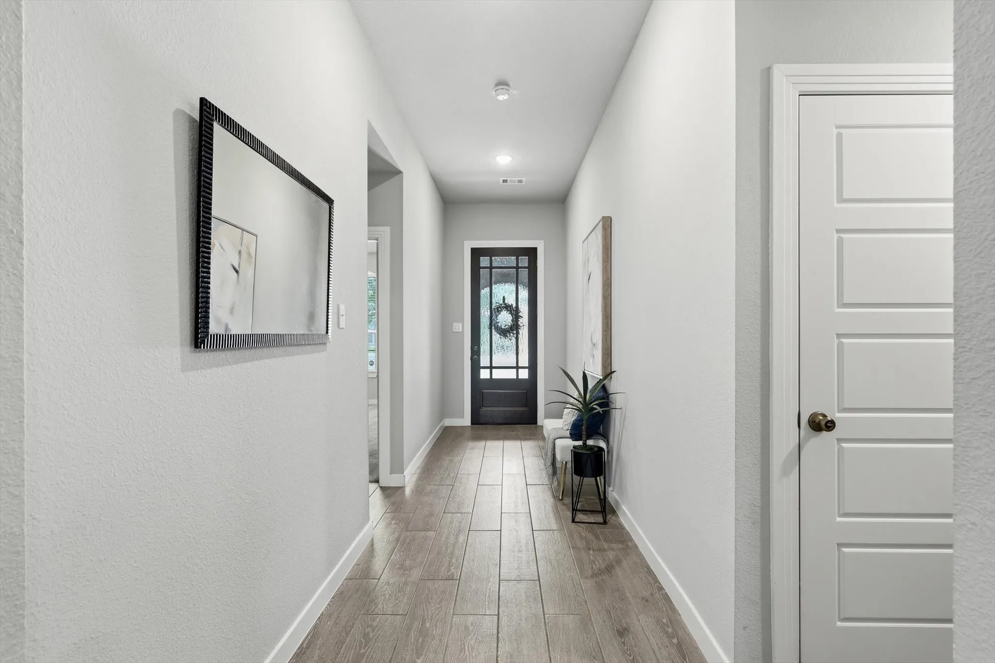 Large entrance foyer showcasing the privacy between primary bedroom and additional rooms.