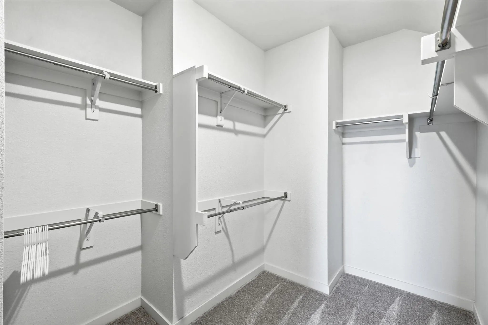 What a closet! This primary closet has tons of room for storage and ready for you to make custom if you choose!