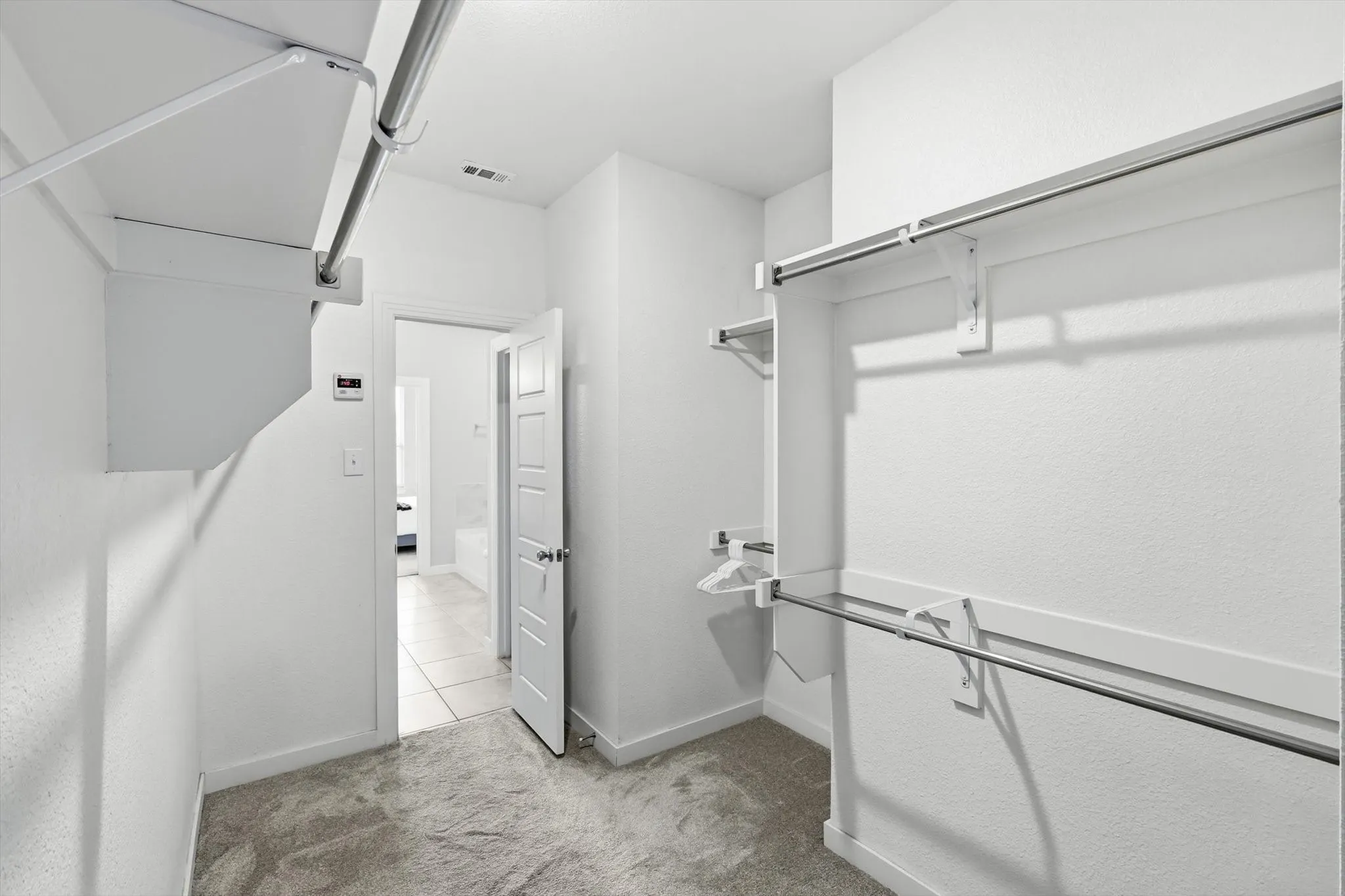 What a closet! This primary closet has tons of room for storage and ready for you to make custom if you choose!