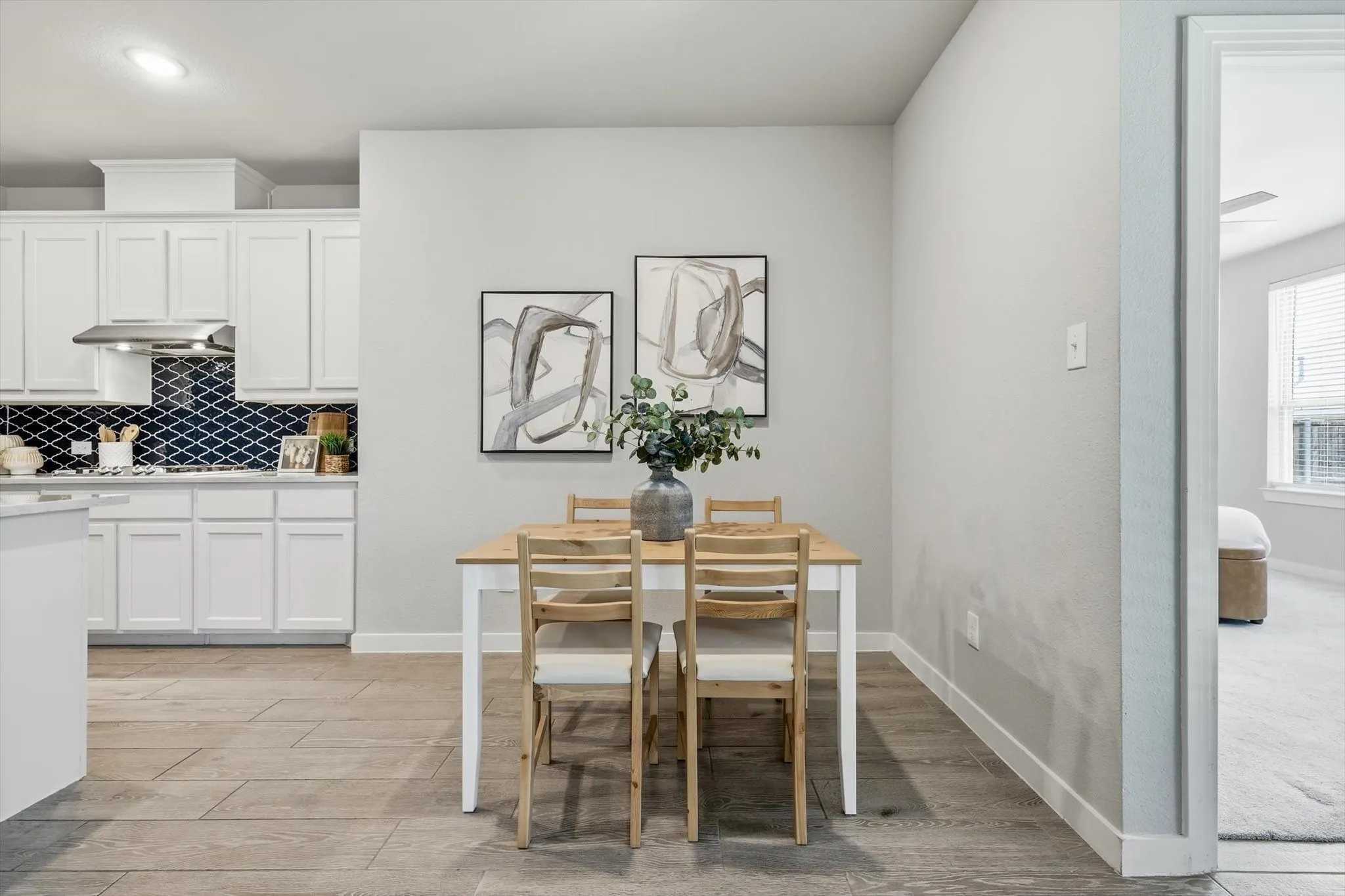 Nice breakfast area right off of the kitchen, this secondary dining space is great for entertaining but also functional.