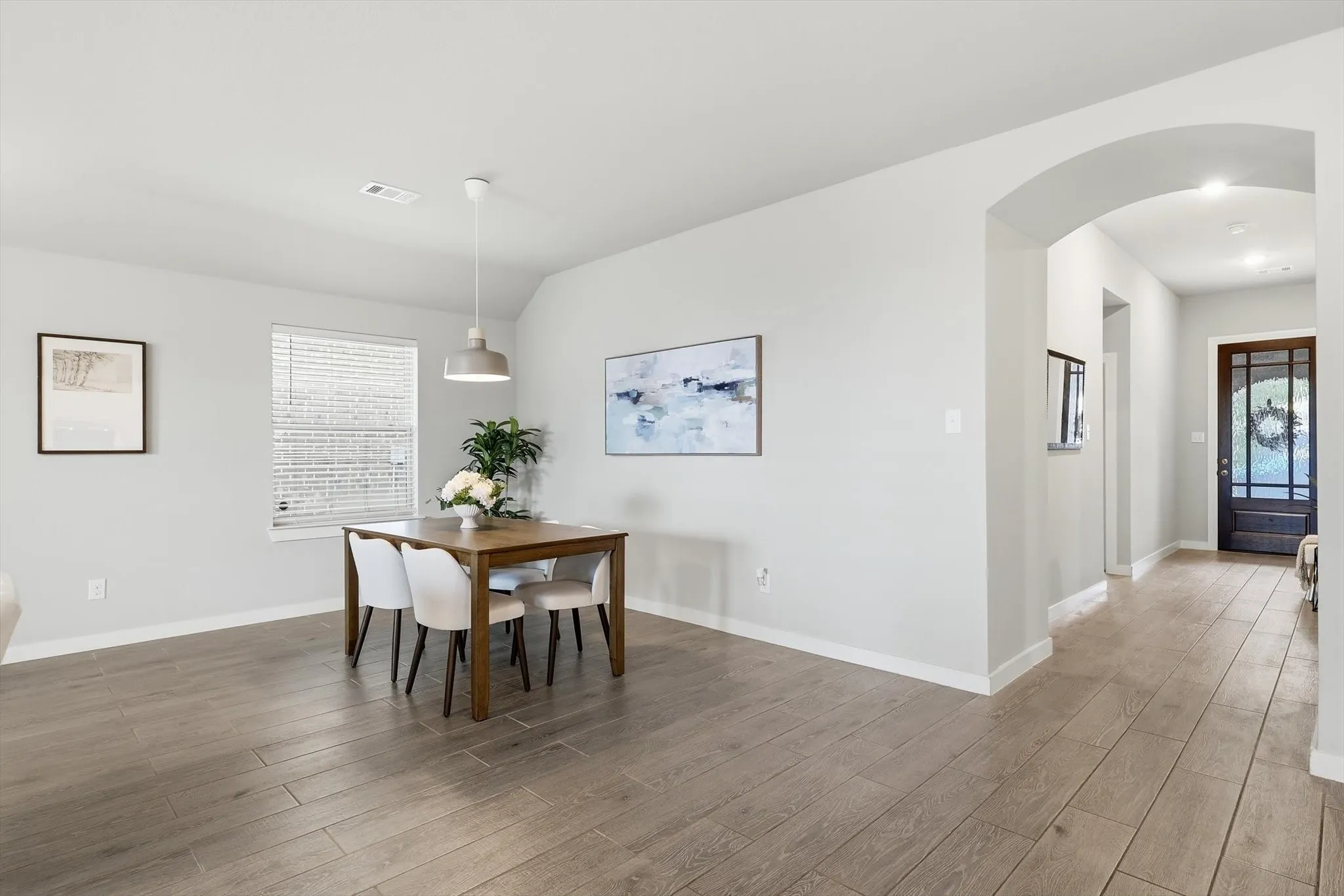 Open concept dining space overlooking the kitchen, living and breakfast area. This can be used as you choose, does not have to be a dining space.