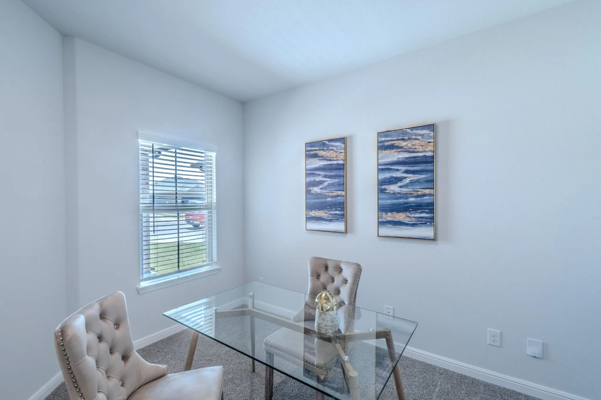 Room featuring light gray wall paint, a single window with blinds, and neutral-toned carpeting