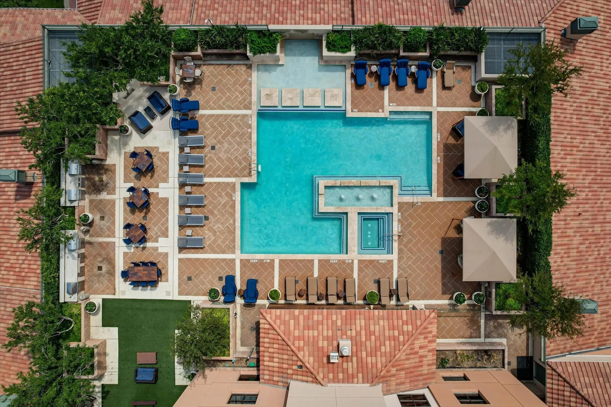 Rooftop amenity deck featuring a swimming pool, integrated spa, and an expansive paver patio