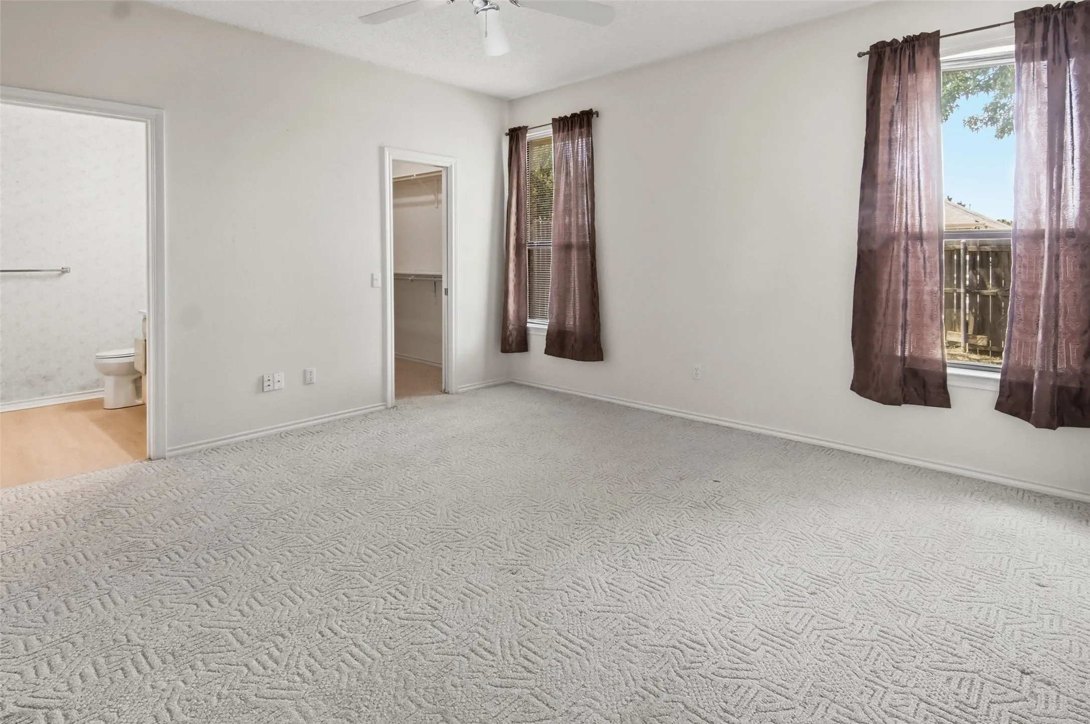 Primary bedroom with walk in closet