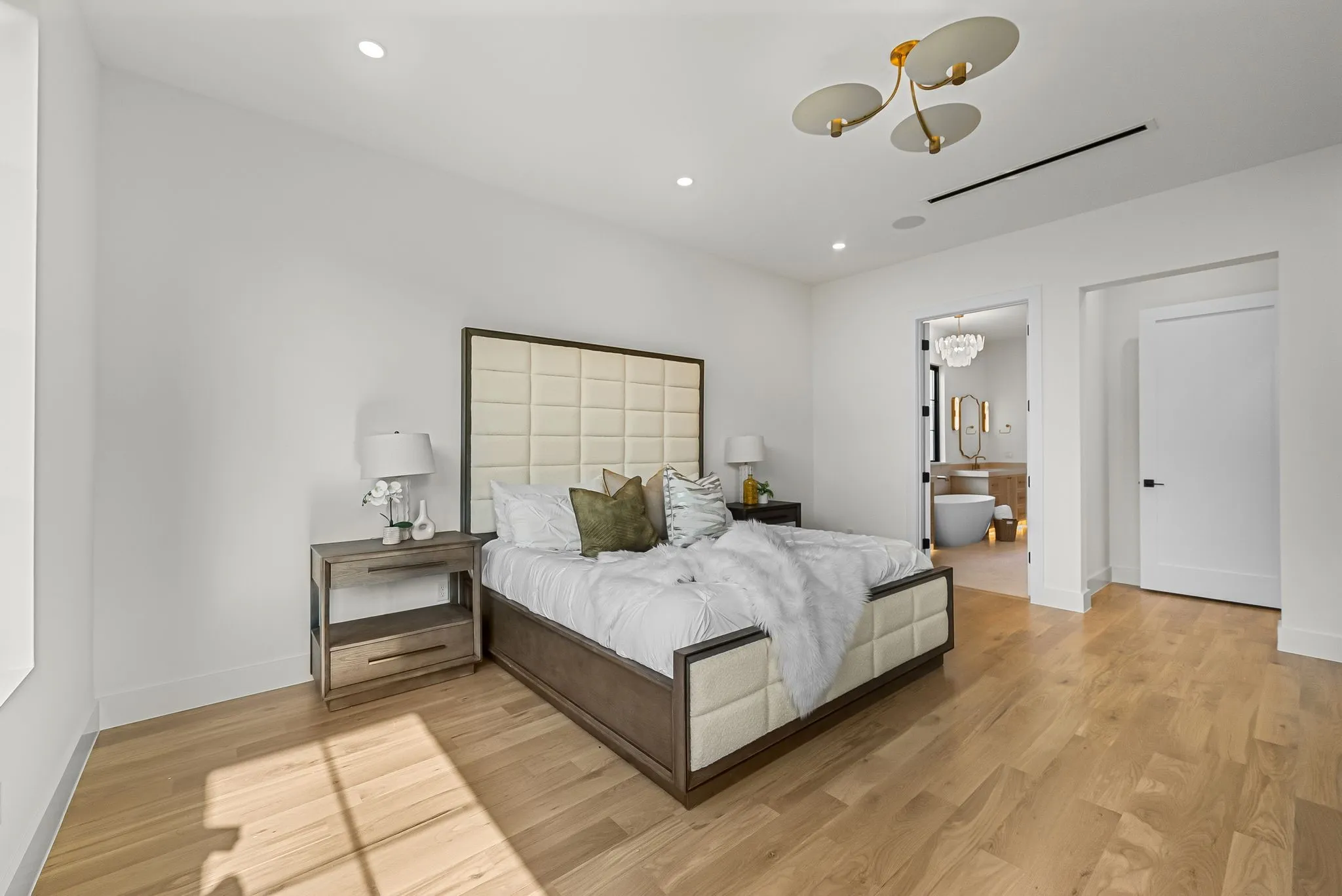 Light wood-finish flooring complements the neutral wall tones
