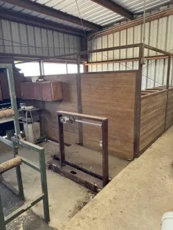 Large office barn features stalls and working areas for livestock