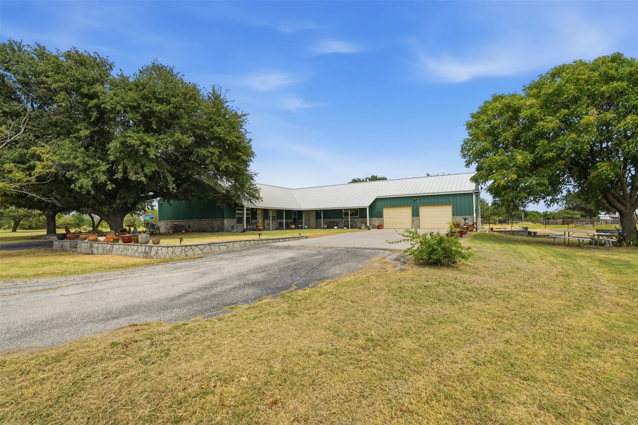 Large two car garage and full back patio with established trees