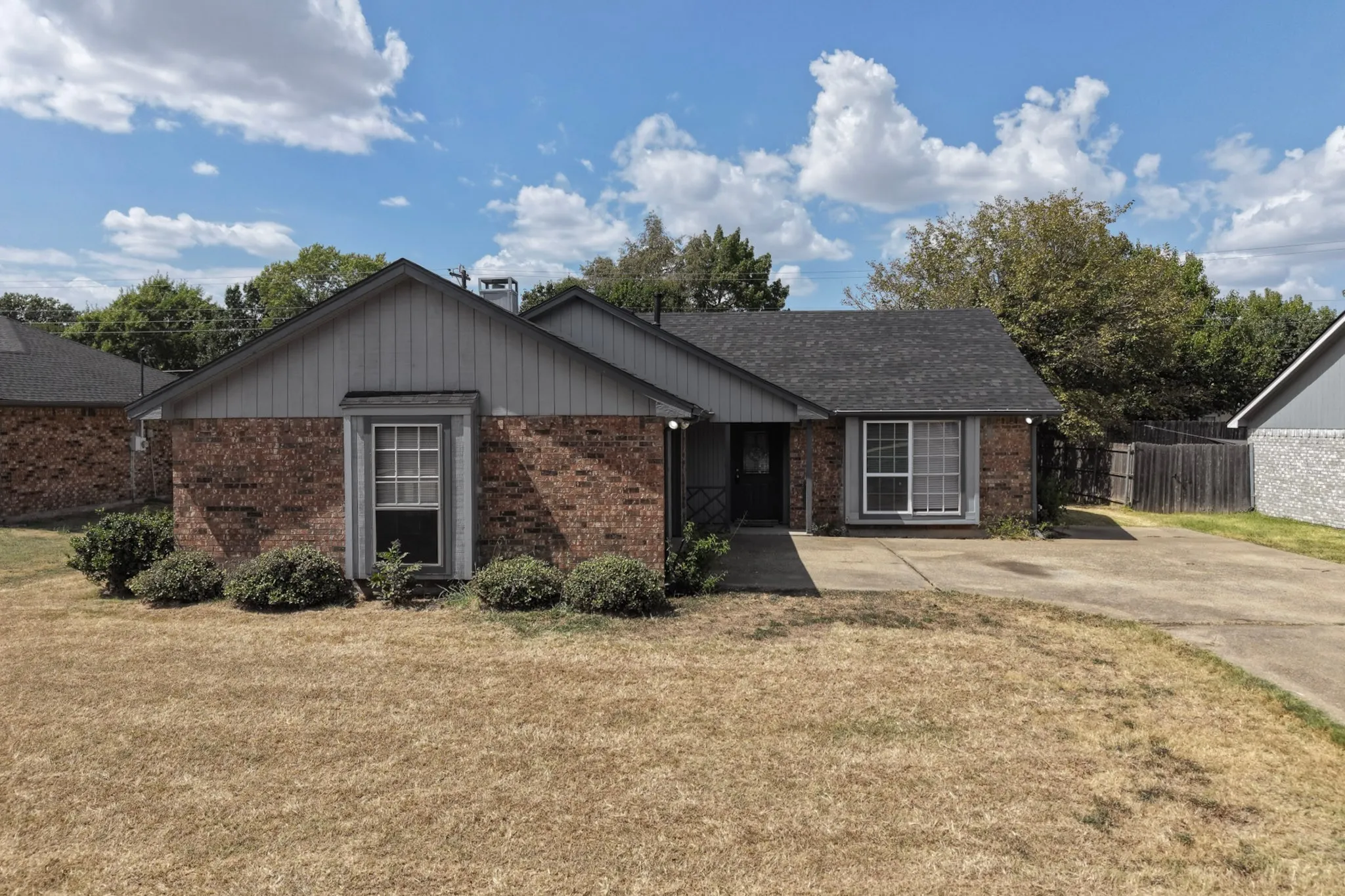 Brick and siding exterior with a gabled roof