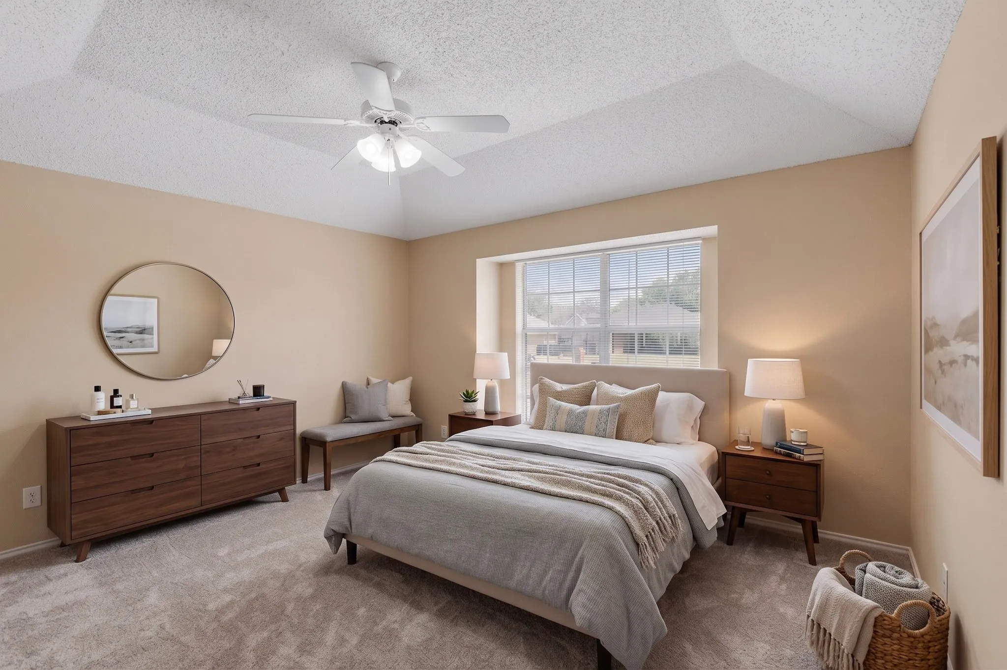 Vaulted ceiling with a ceiling fan, carpeted flooring, large window with blinds, and neutral wall tones