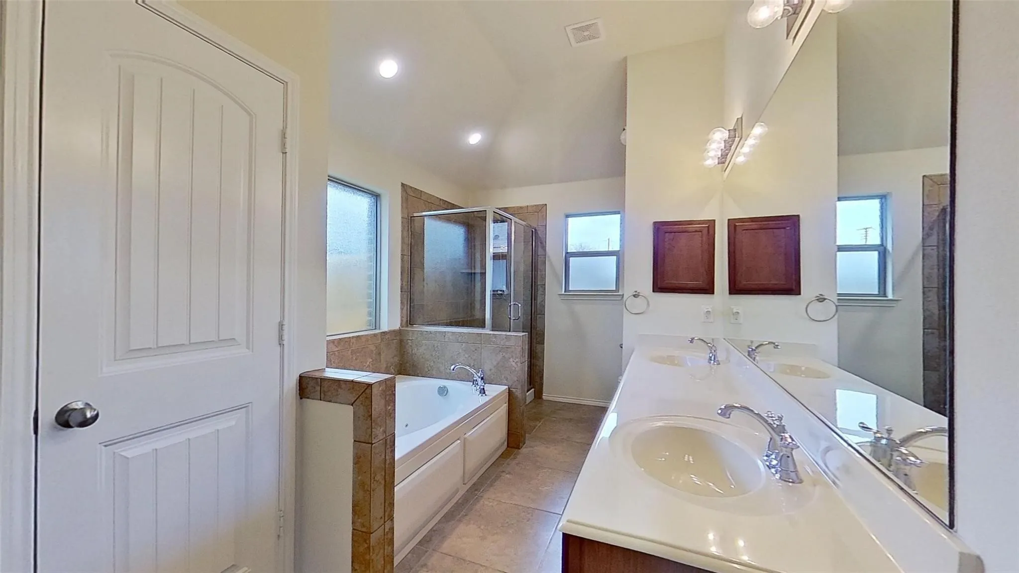 Dual vanity with integrated sinks and chrome fixtures