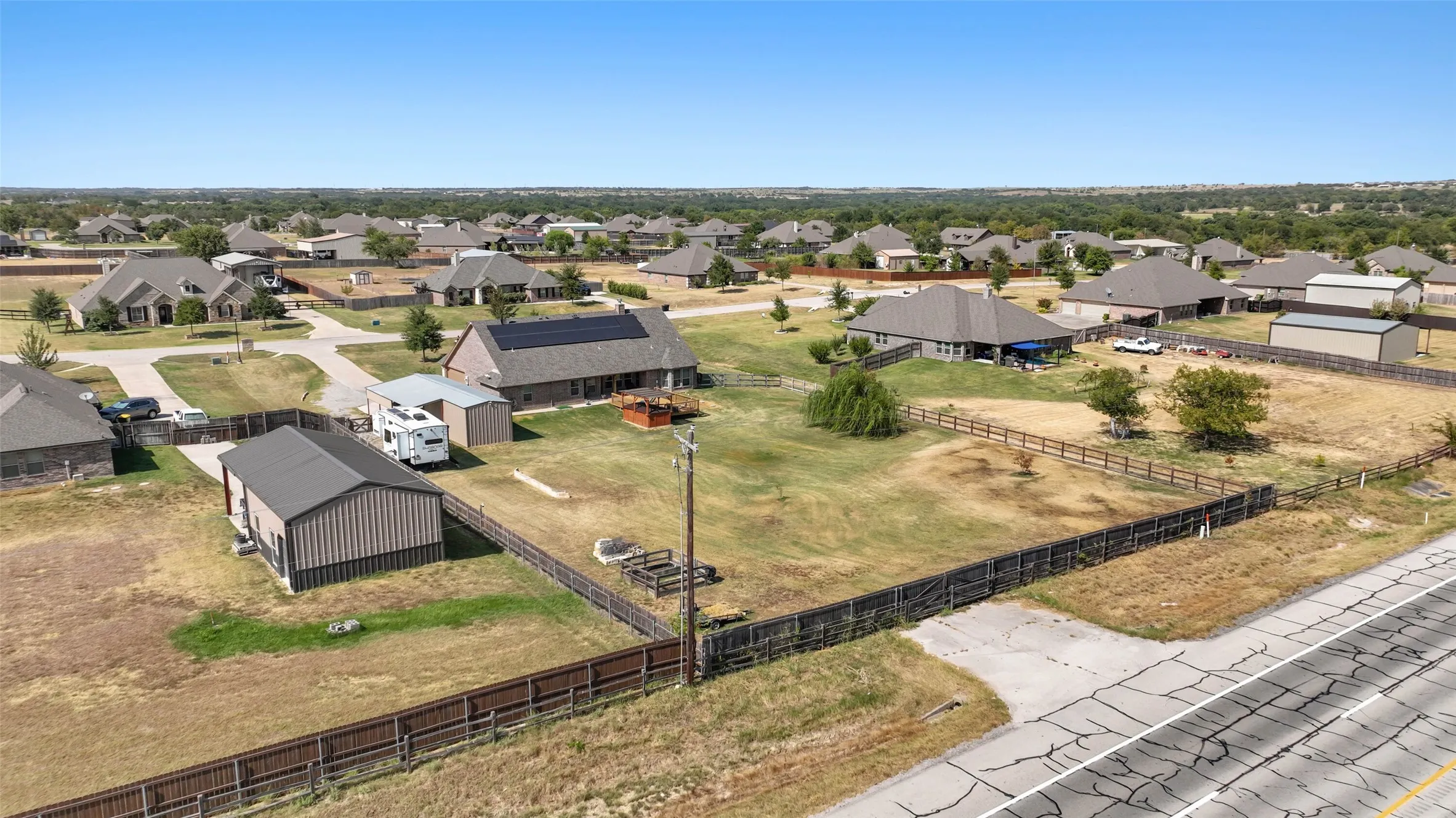 Driveway access off of hwy 380 with gate for RV pull-through.