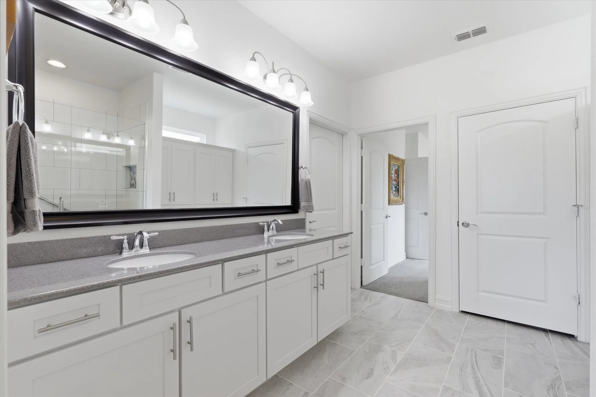 Two sinks in the large vanity.