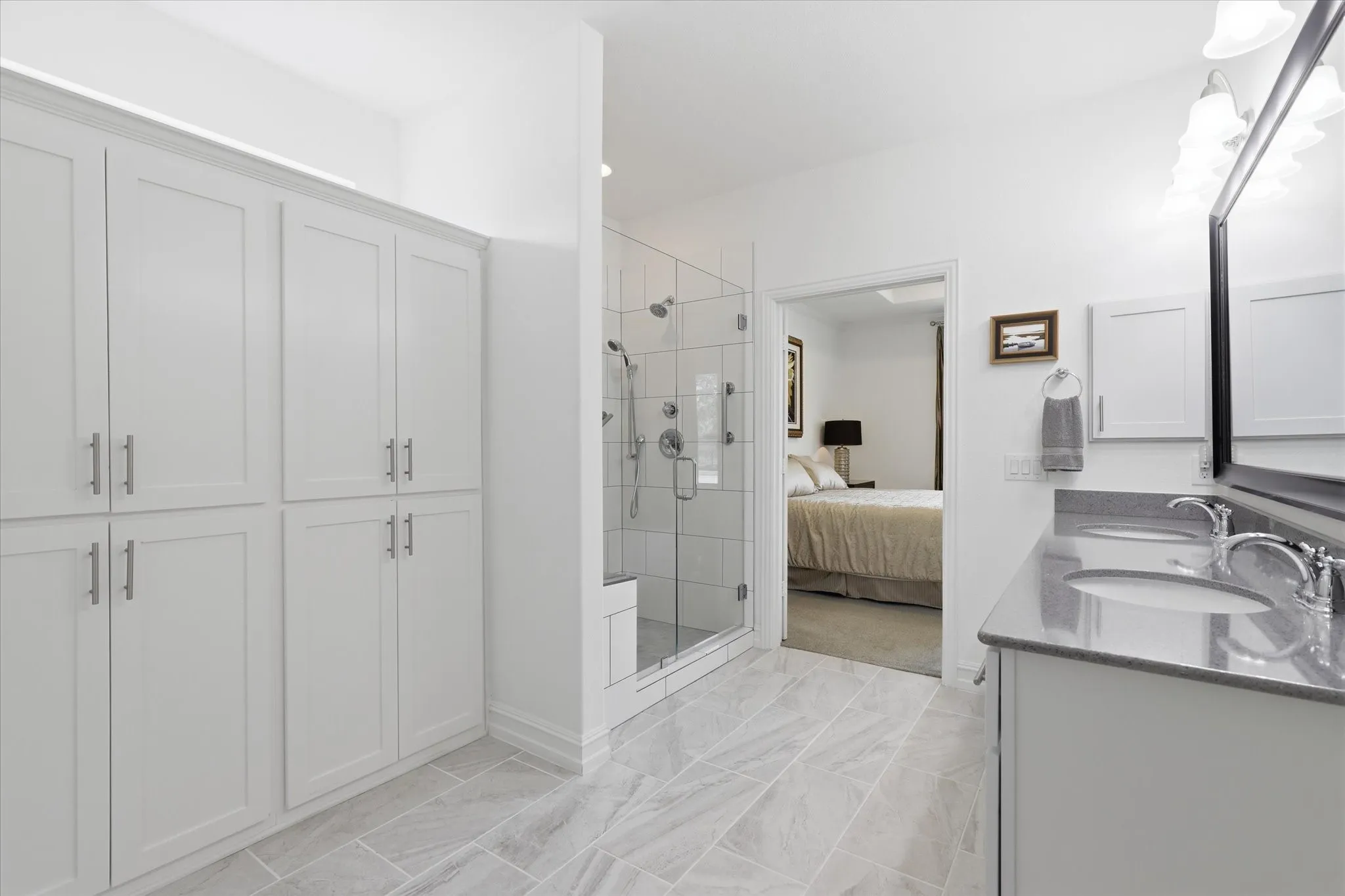 Custom built in cabinets in the primary bedroom is great for linens, sweaters, jeans etc.